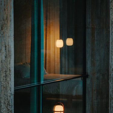 Globo Cestita pendant lamp suspended above minimalist dining table