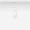 Gople Mini Pendant Light by Artemide hanging in a dining area