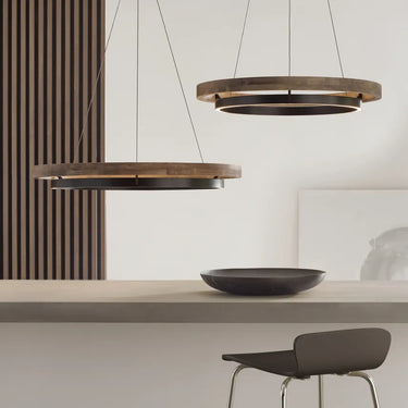 Contemporary wood and metal LED pendant light fixture for residential and commercial interiors installed on top of the counter top