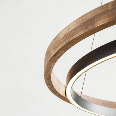 Sean Lavin two-ring chandelier in oak and black finish illuminating a modern living room