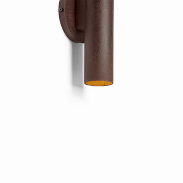 Detailed close-up of the unique oxidized texture on the Graypants Roest steel sconce Rust finish.