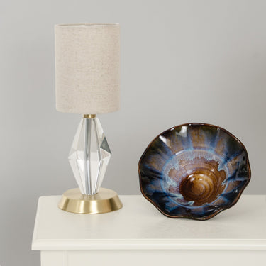 Bryson Mini Crystal Tapered Column Accent Lamp in Satin Brass styled in a lived-in room – House of Troy