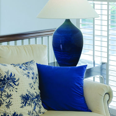 Scatchard 27" Stoneware Table Lamp, Style GS190 in Blue Gloss styled in a lived-in room – House of Troy