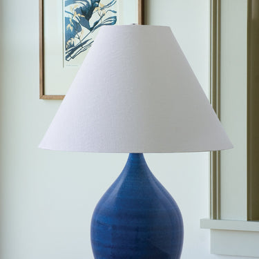 Scatchard 22.5" Stoneware Table Lamp, Style GS300 in Blue Gloss styled in a lived-in room – House of Troy