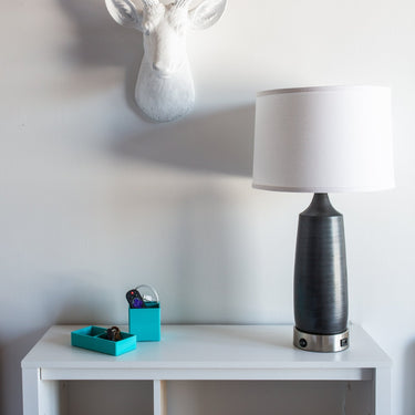 Scatchard 26" Stoneware Table Lamp with USB Base in Black Matte styled in a lived-in room – House of Troy #2