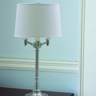 Lancaster 31.75" Six-Way Table Lamp in Satin Nickel styled in a lived-in room – House of Troy
