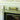 Mantel 14" Uplight in Antique Brass styled in a lived-in room – House of Troy