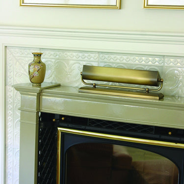 Mantel 14" Uplight in Antique Brass styled in a lived-in room – House of Troy