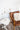 Orwell LED Counterbalance Table Lamp in White with Weathered Brass Accents styled in a lived-in room – House of Troy