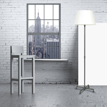 Studio 63" Industrial Floor Lamp in Granite styled in a lived-in room – House of Troy