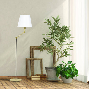 Taylor Adjustable Floor Lamp styled in a lived-in room – House of Troy