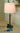 Townhouse Adjustable Table Lamp with Outlet styled in a lived-in room – House of Troy