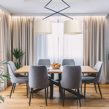Uptown Double Adjustable Pendant styled in a lived-in room – House of Troy