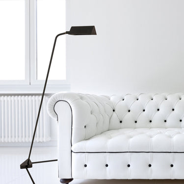 Victory 48" Floor Lamp with Metal Shade in Black styled in a lived-in room – House of Troy