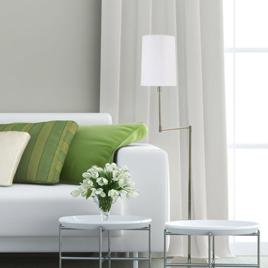 Wolcott 61.75" Floor Lamp styled in a lived-in room – House of Troy