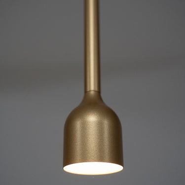Detail of the Penta Hail pendant in matt gold