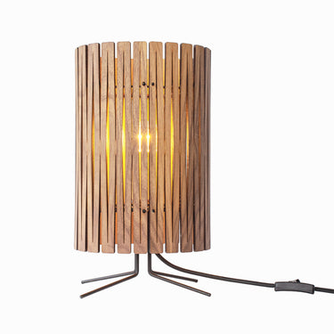 Kerflights T2 modern bedside table lamp in Black Walnut finish providing warm ambient light. 