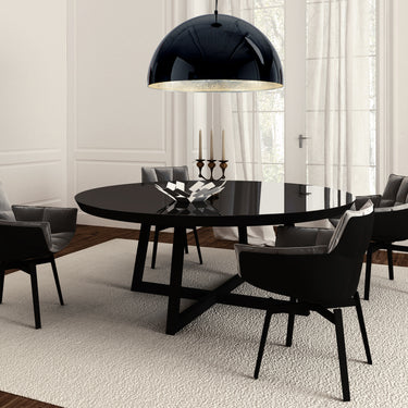 ET2 Hemisphere Gloss Black dome pendant hanging over a round black dining table with dark chairs