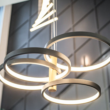 ET2 Hoopla black rings around a gold column glowing against a dark paneled wall, seen from below