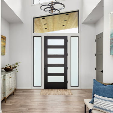 ET2 Hoopla multi-ring pendant hanging in a bright entry foyer