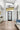 ET2 Hoopla multi-ring pendant hanging in a bright entry foyer