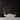 ET2 Hover thin black baton pendants floating in front of a black round feature wall in a dark living room