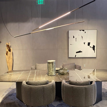 Ilo horizontal pendants over a coffee table and armchairs in a showroom lounge
