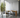 Innermost Brixton large whiter spot pendant, creating ambient lighting in a contemporary hotel reception area, engineered aesthetic.