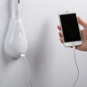 Elegant white leather Innermost Cobra lamp with dimmable LED and built-in USB charging for minimalist interiors.
