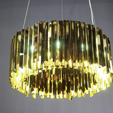 Contemporary faceted pendant light for high ceilings in dining area in brass finish