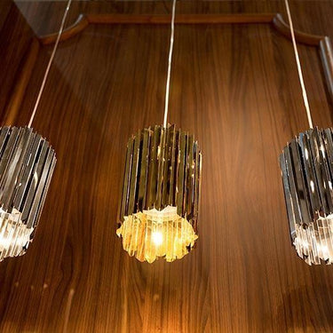 Modern bronze finish Innermost Facet 18 pendant light, 11-inch height, adding sophisticated ambient glow to a bedroom or entryway.