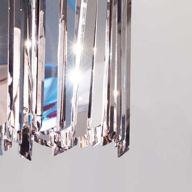Grouping of Innermost Facet 18 mini pendants, mixed finishes (brass, bronze, stainless steel), showcasing versatile design for commercial spaces.