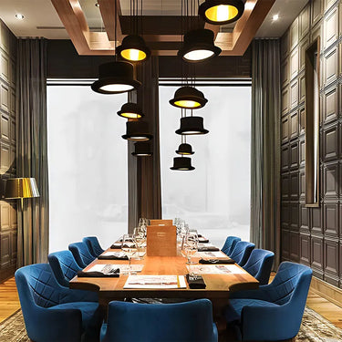 British bowler hat pendant light for modern interiors – Jeeves by Innermost installed in a fine dining restaurnat