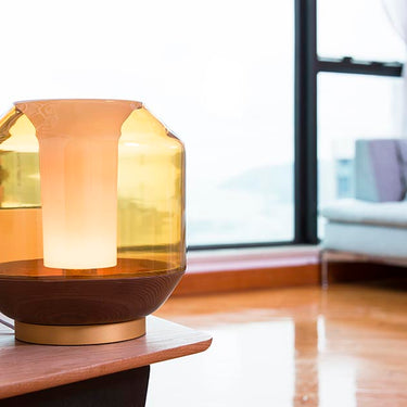 Amber glass table lamp with wood base for modern bedroom lighting