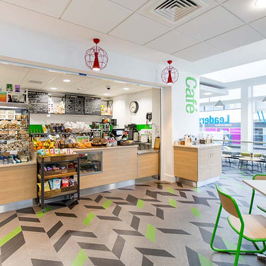 Contemporary LED ceiling fixture for offices and hospitality spaces installed in a grocery store
