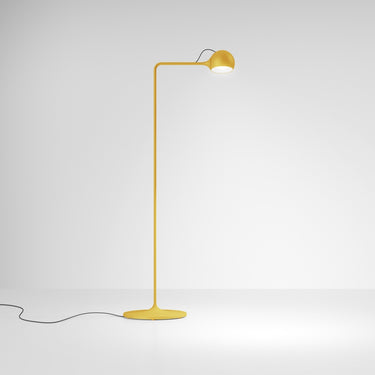 Contemporary yellow task floor lamp with dome head and clean silhouette