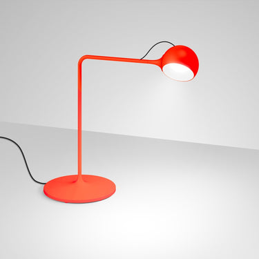 Red LED table lamp with hidden cable design and color options for home, office, and hospitality