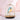 Aqua Blue Jingoo by Daqiconcept glowing beside pale pink linens