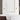 1 Light ADA Wall Sconce with Warm LED – Visual Comfort Phobos in Brass Finish installed beside the bathroom mirror