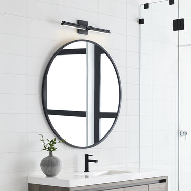 Visual Comfort 24” black vanity light with frosted diffuser for home and professional spaces
