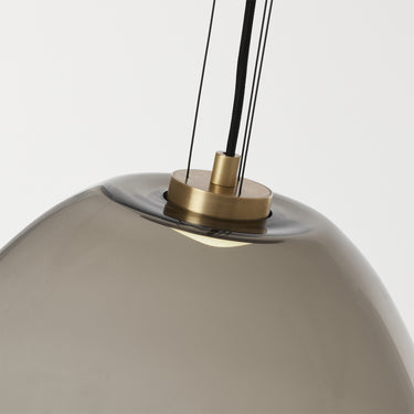 Modern large glass pendant light in transparent smoke finish for home offices or commercial lounges