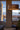 Kerflights wood drum pendant in a tall penthouse-style Graypants interior photograph