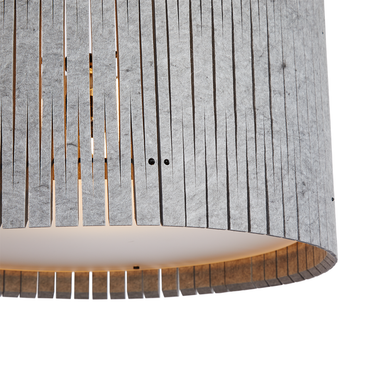 Kerf pattern pendant lighting with ambient light diffusion.