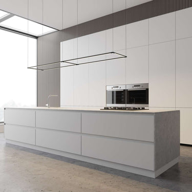 The Z-Bar Rectangle pendant light casting a warm, 3000K glow in a minimalist modern kitchen setting.