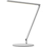 Minimalist silver task light, the Z-Bar Solo Pro Gen 4, on a wooden study desk.