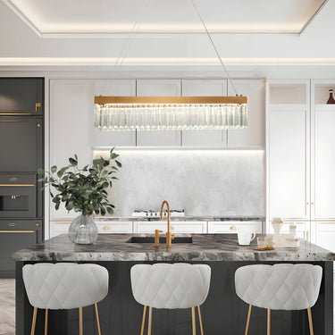 Crystal pendant light illuminating a modern dining room table