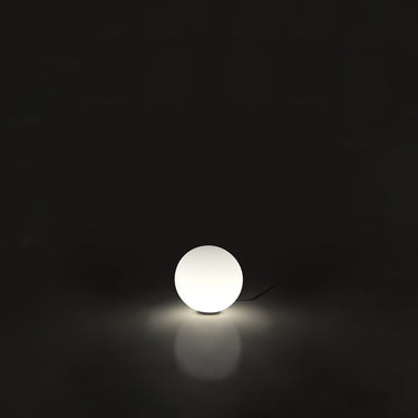 Modern Dioscuri white glass table lamp for bedrooms, reception areas, and upscale lounges