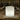 Lantern Bluetooth LED Cordless Lamp by Smart & Green glowing white on a restaurant table beside wine glasses - LoftModern