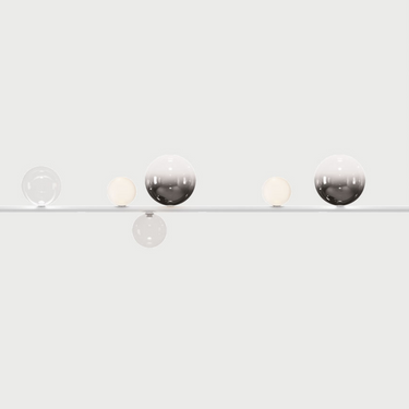 Luxury linear pendant lighting for dining room with frosted and clear glass globes and integrated LEDs