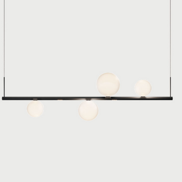 Lodes Random Stick Short LED pendant over dining table modern interior